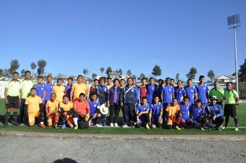 Finalists of the Rev Zotuo Football Trophy Men's fellowship (Orange jersey) and Koinonia Prayer Centre Team (Blue jersey) alongwith Kohima Town Club football referees and the organising committee.